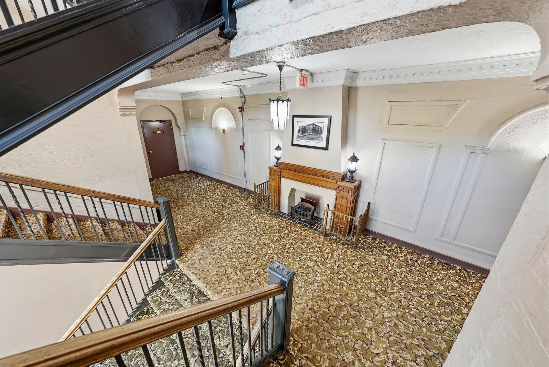 Cambridge Apartments — heritage landing with fireplace