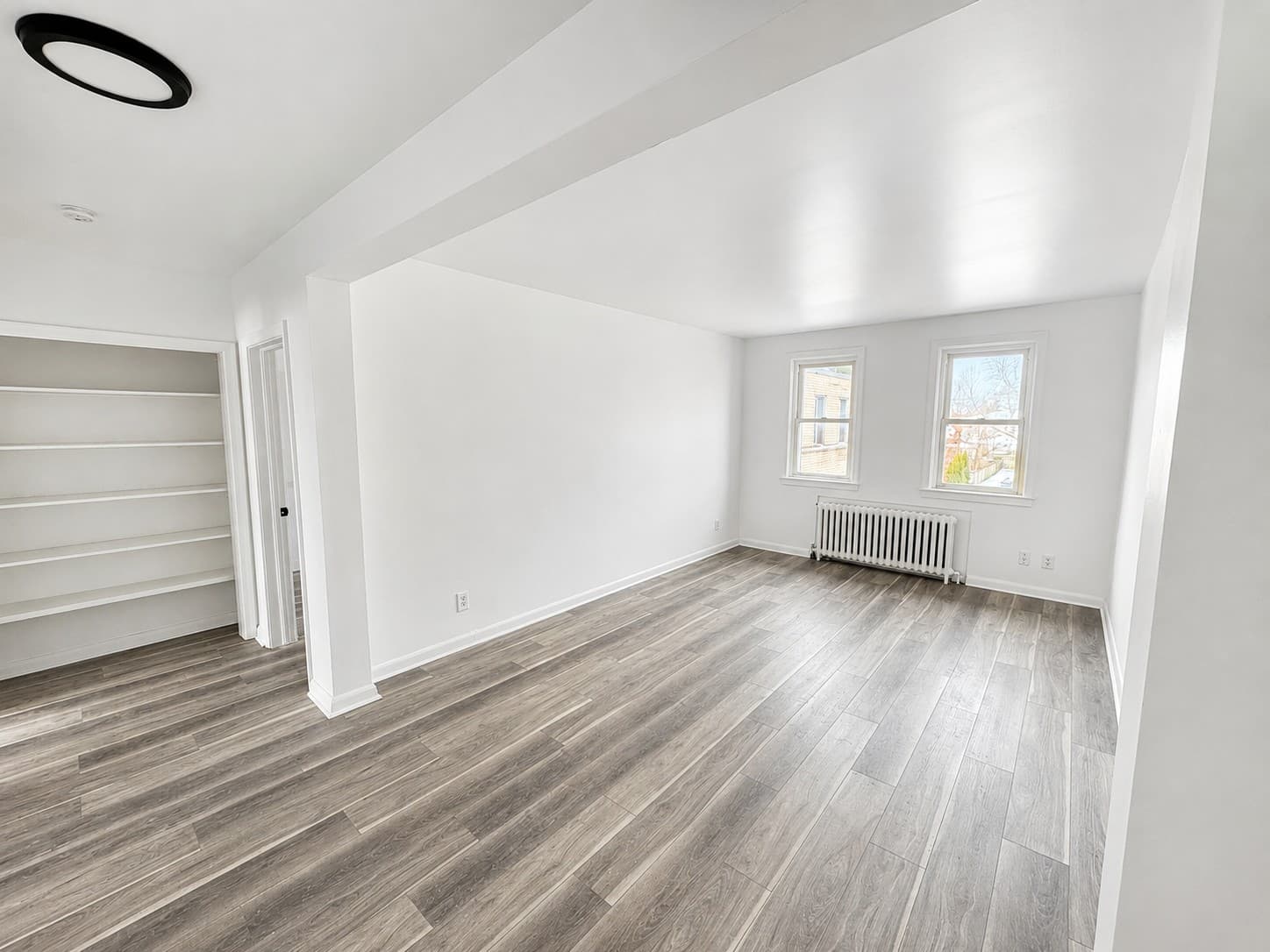 Clarence Apartments — living room with built-in shelving