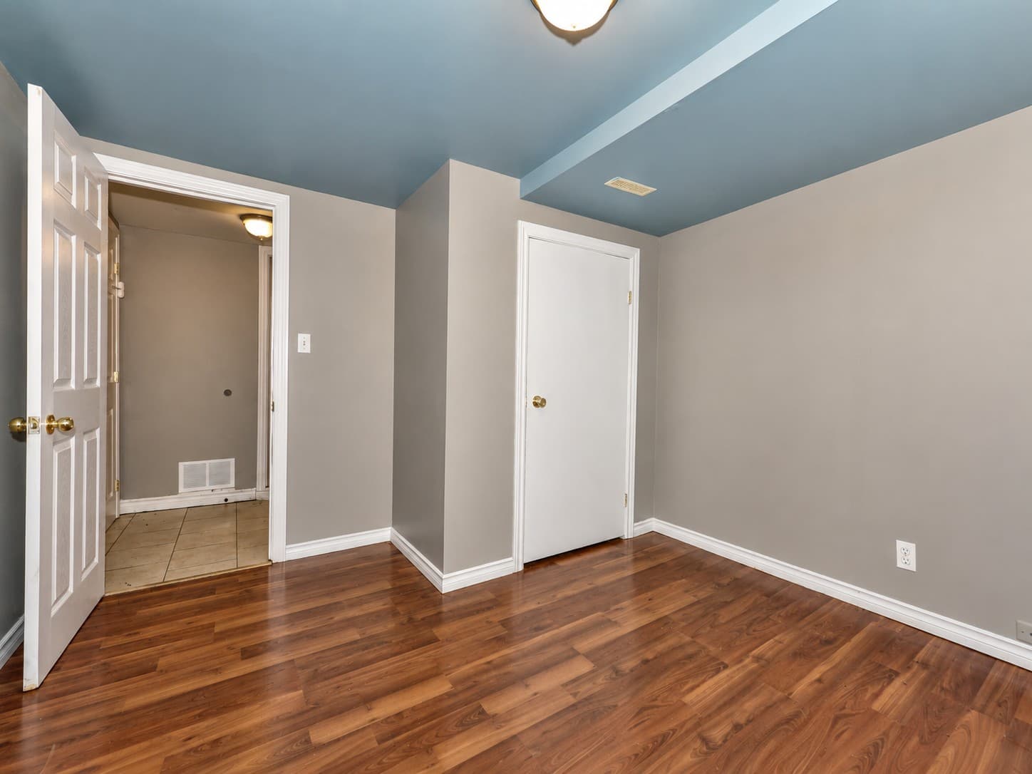 Colborne Apartments — 763 — bedroom with hardwood-style flooring