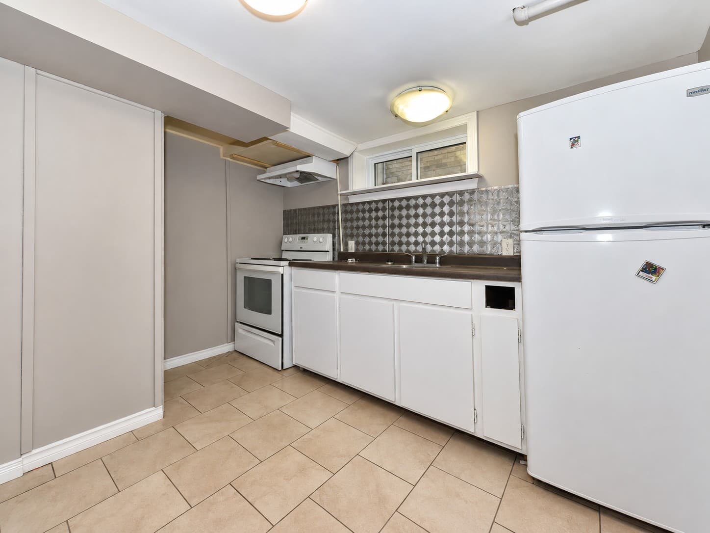 Colborne Apartments — 763 — kitchen with white cabinets