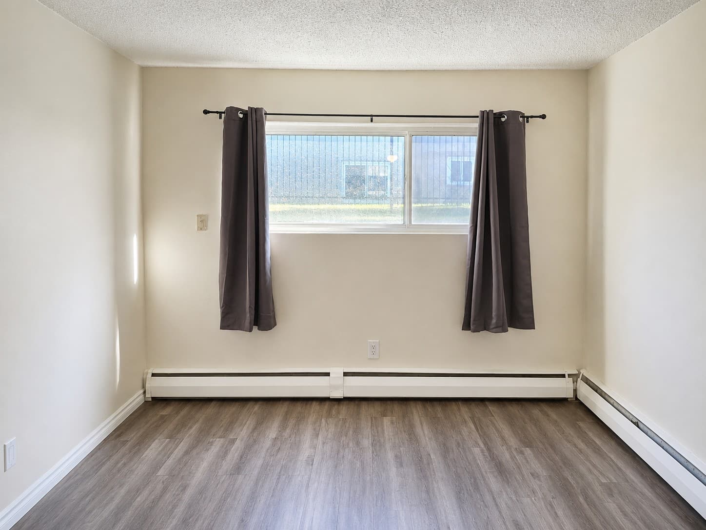 Dakota Apartments — bedroom with large window