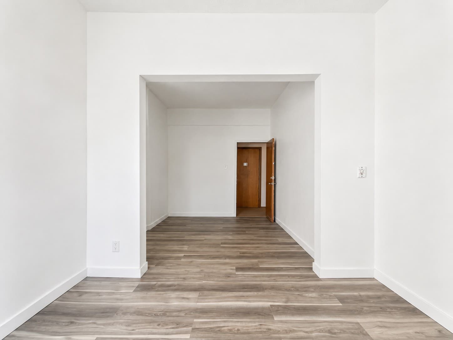Main Apartments — open living space with entry